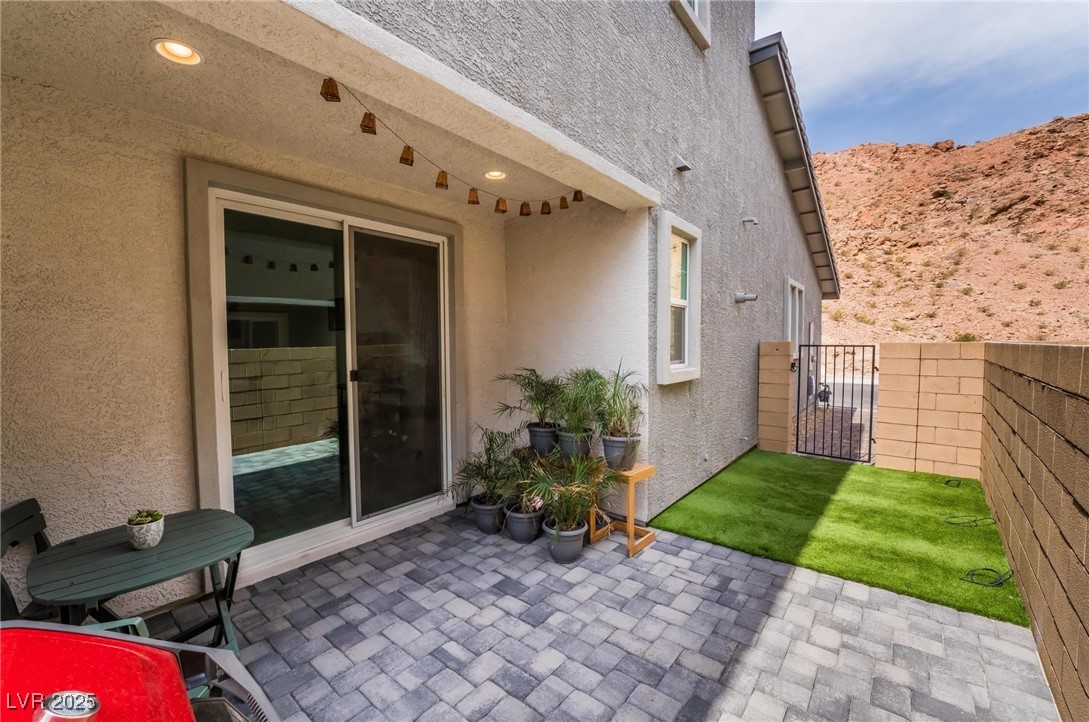 128 Kimberlite Drive Henderson, NV 89011 - Photo 27 of 55 View of patio / terrace with a gate