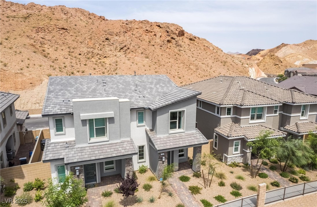 128 Kimberlite Drive Henderson, NV 89011 - Photo 44 of 55 View of front of home with stucco siding, a mountain view, and a residential view