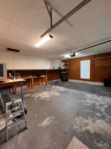 a view of a storage & utility room with closet wooden floor
