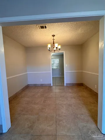 a kitchen with stainless steel appliances a sink and a refrigerator