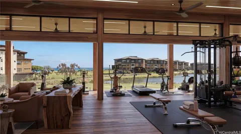 a living room with lots of furniture and floor to ceiling window