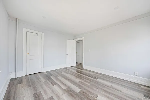 a view of room with wooden floor
