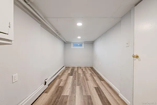 a view of wooden floor in a hallway