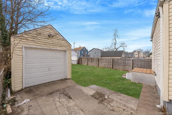 a view of a backyard with barn and entertaining space