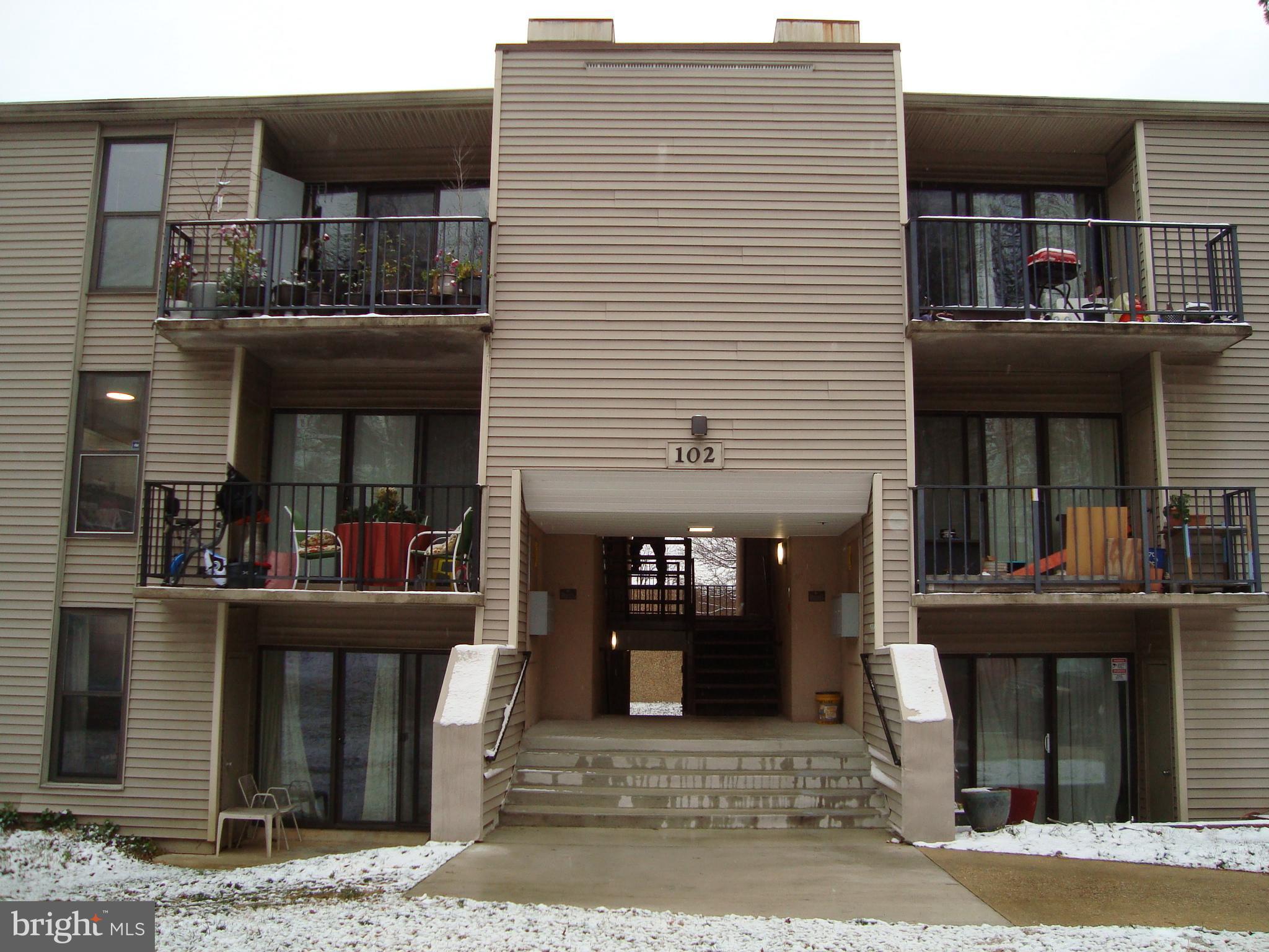 a front view of a houses on the roadside