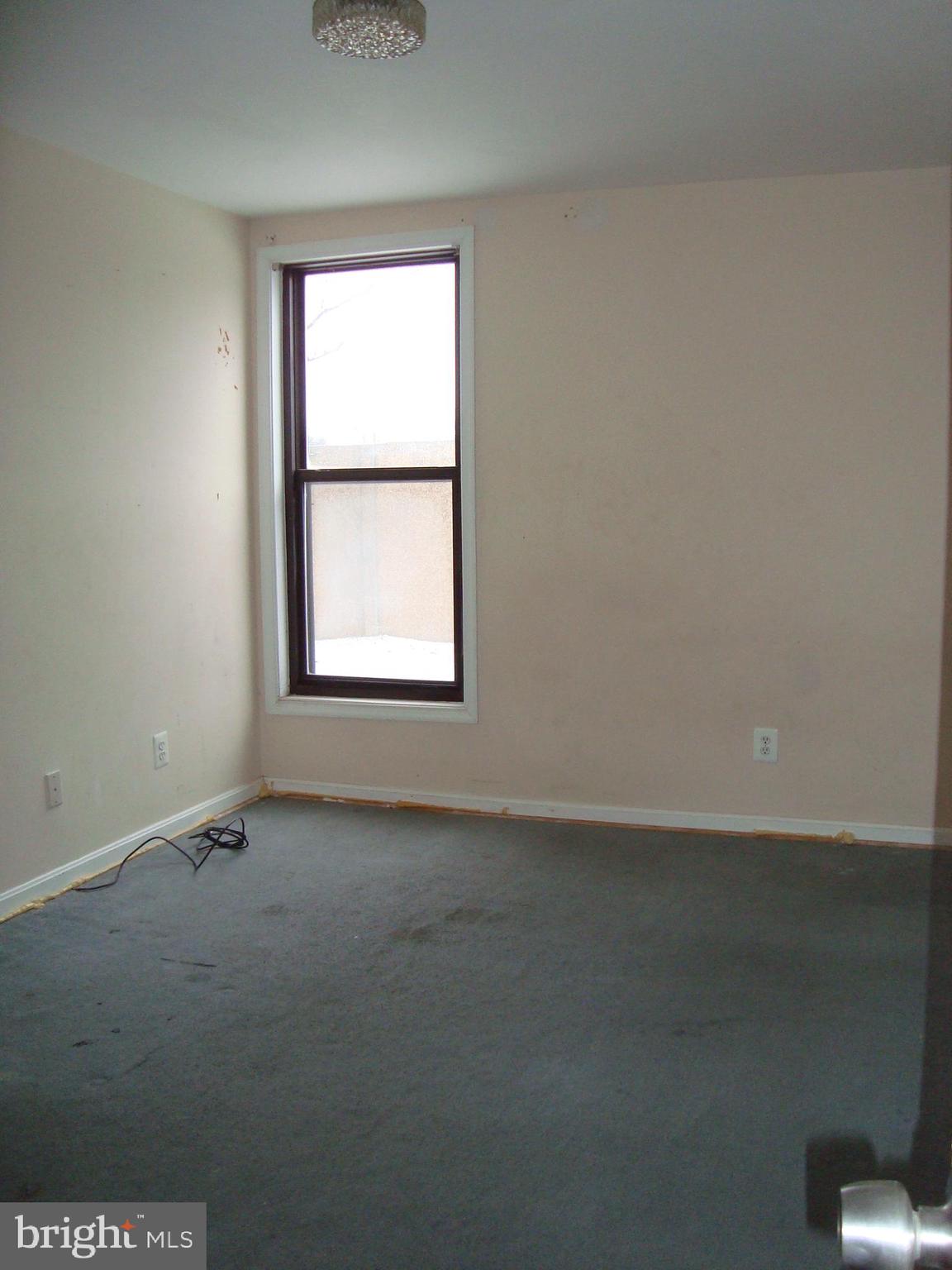 102 Duvall Lane, Unit 6202 Gaithersburg, MD 20877 - Photo 16 of 23 an empty room with a window