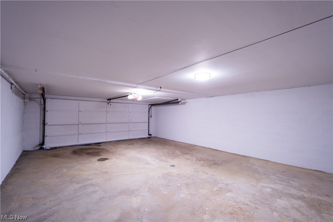 9980 Chardon Road Chardon, OH 44024 - Photo 39 of 46 Garage featuring a garage door opener