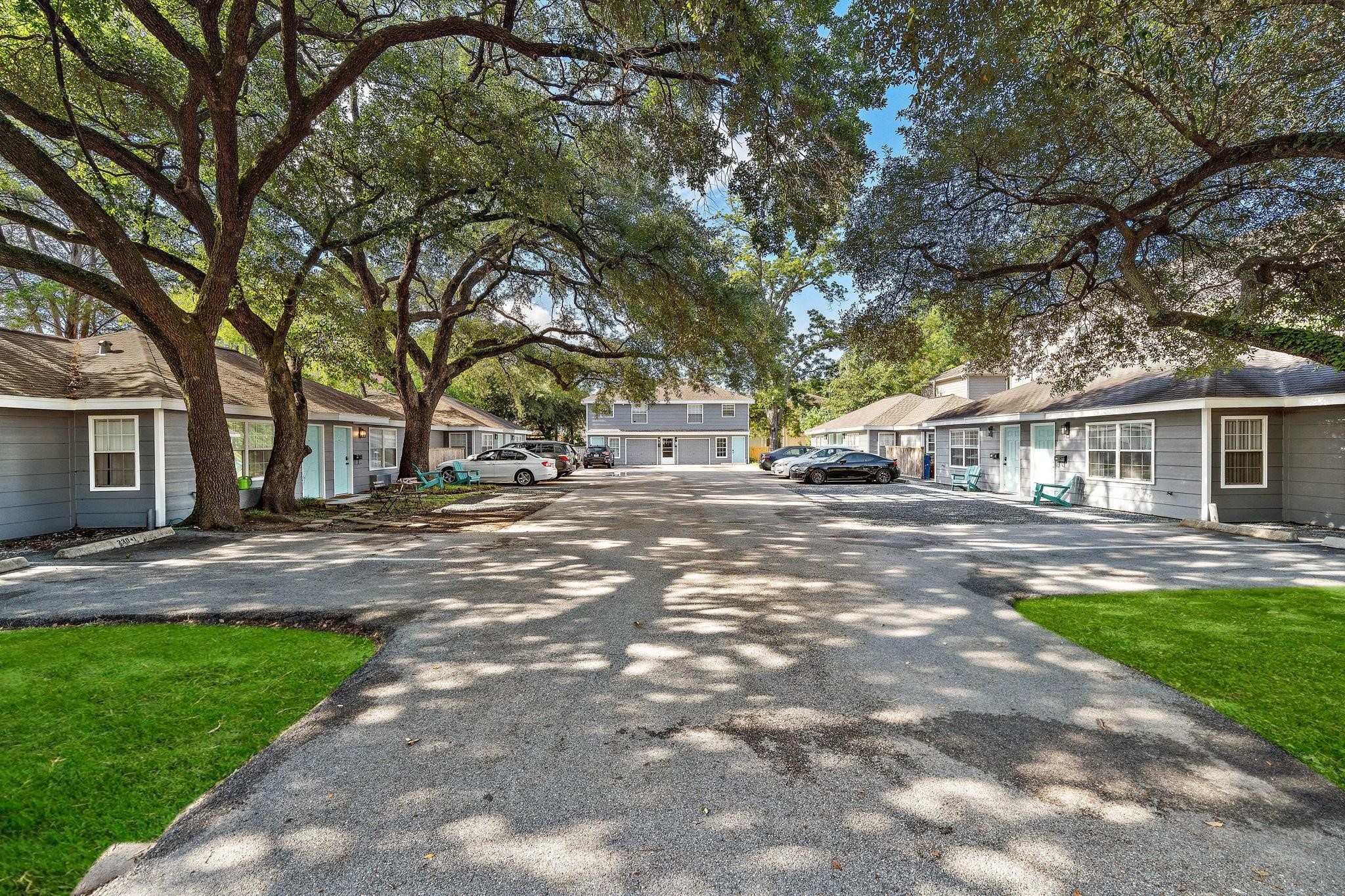 a view of road with trees in front of it