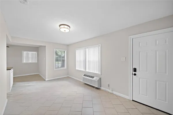 a view of an empty room with a window