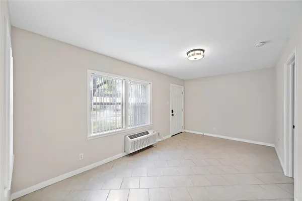 a view of an empty room with a window