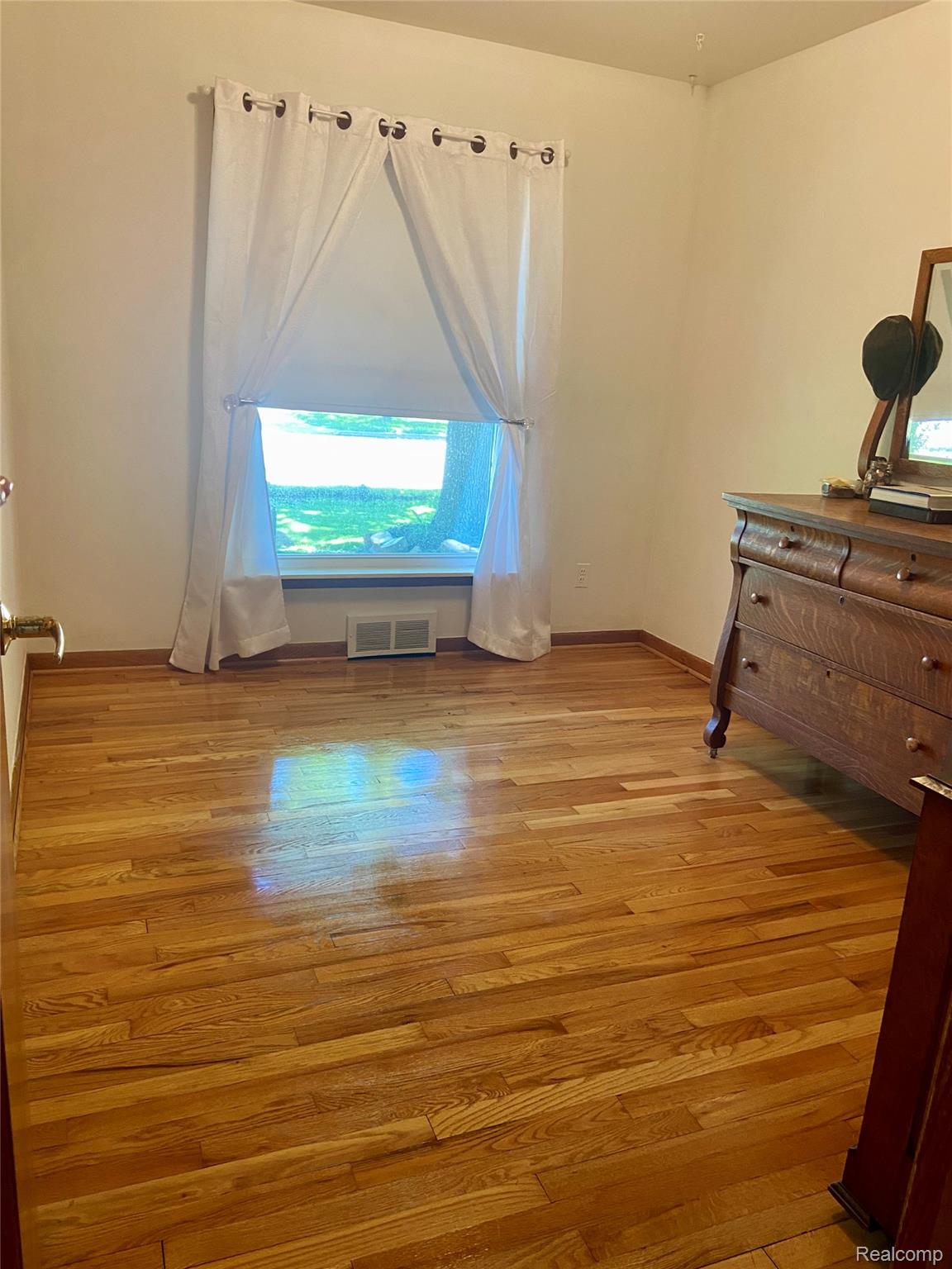 17812 Quarry Road Riverview, MI 48193 - Photo 16 of 25 Unfurnished bedroom with light wood-style flooring and baseboards