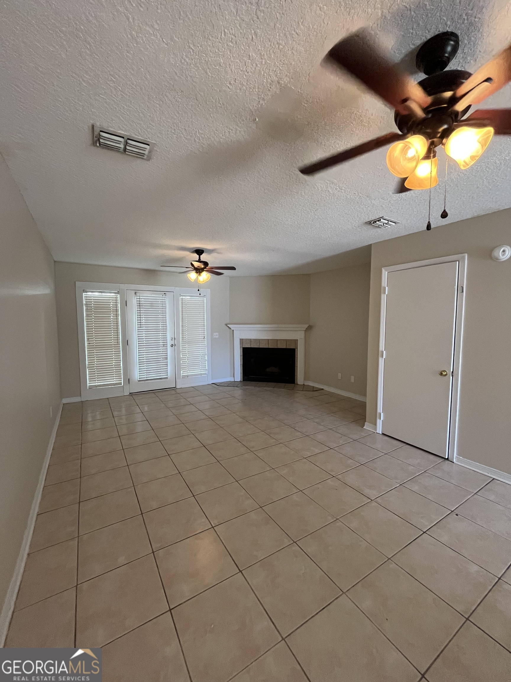 109 Inlet Reach Circle St. Marys, GA 31558 - Photo 5 of 16 a view of empty room with a ceiling fan and window