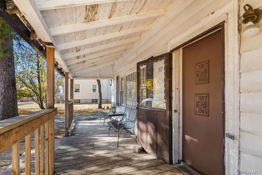 309 Gate Hill Coop Road Stony Point, NY 10980 - Photo 17 of 23 a view of a hallway with the view of living room with furniture