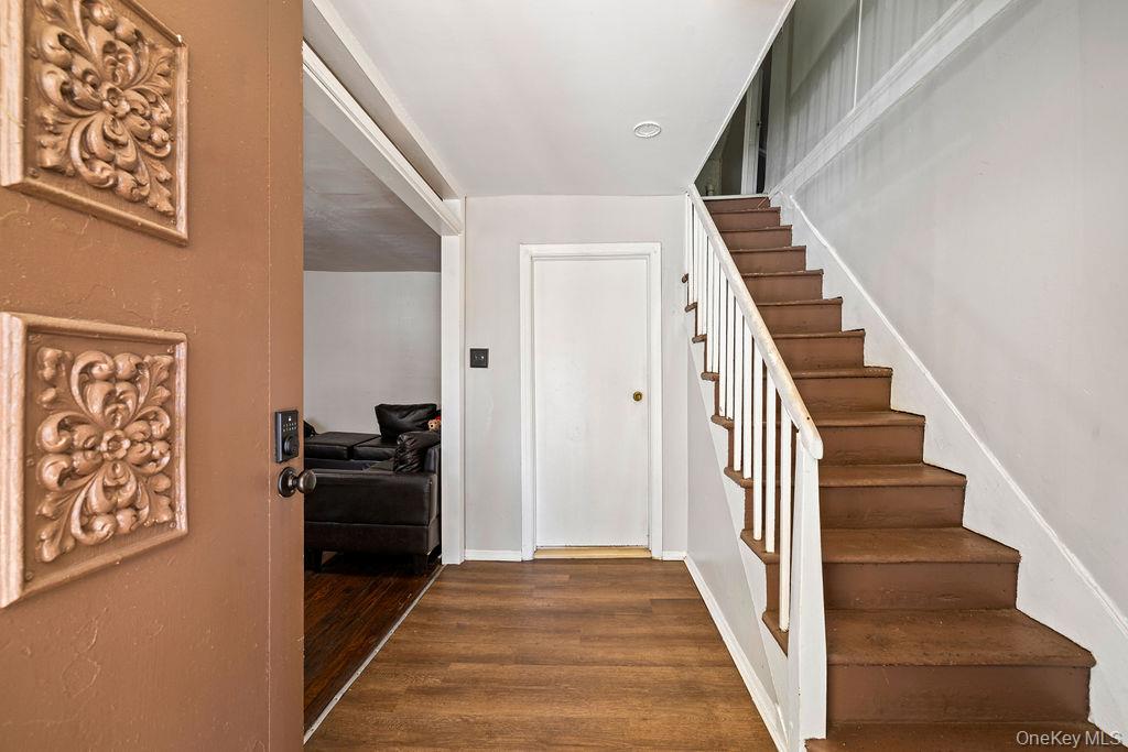 309 Gate Hill Coop Road Stony Point, NY 10980 - Photo 3 of 23 a view of a hallway with wooden floor and staircase