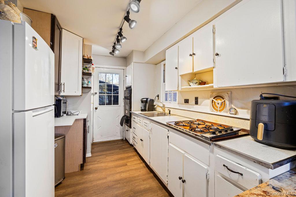 309 Gate Hill Coop Road Stony Point, NY 10980 - Photo 9 of 23 a kitchen with stainless steel appliances granite countertop a stove and a refrigerator