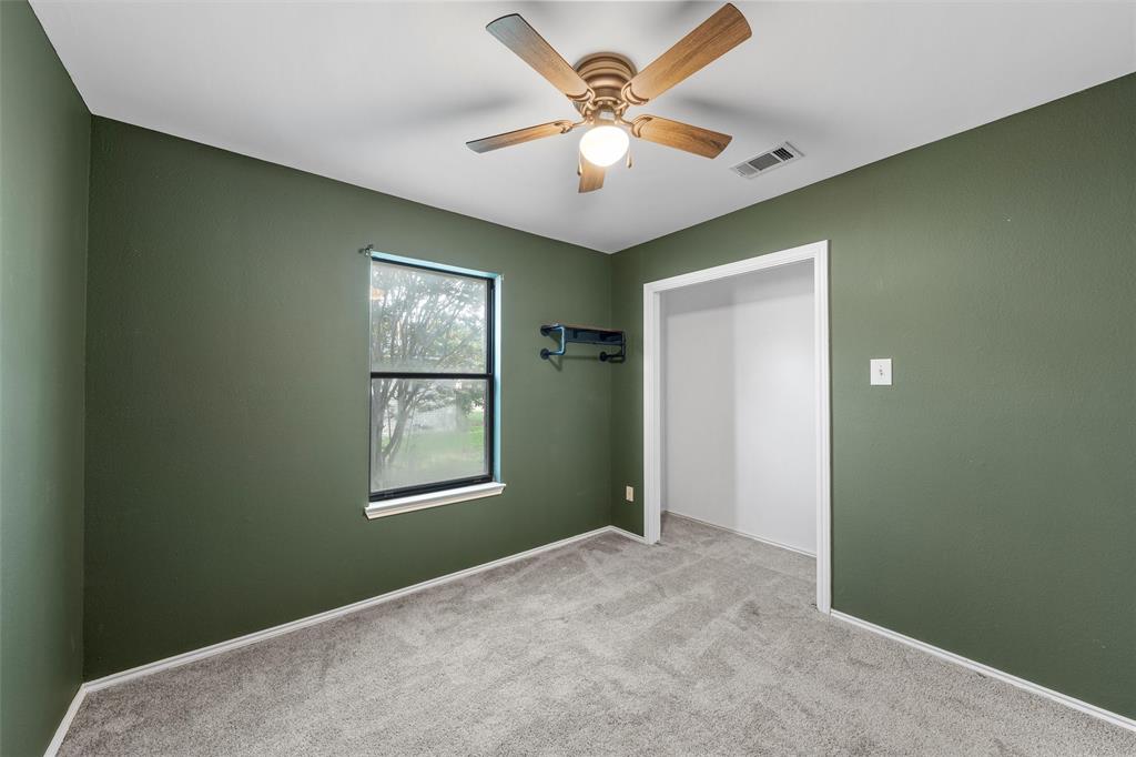 1010 December Drive Hewitt, TX 76643 - Photo 14 of 25 a view of an empty room with window and closet area