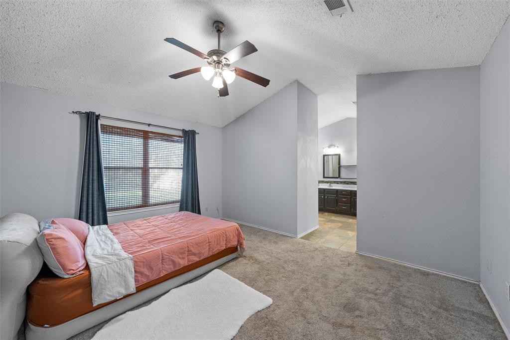 1010 December Drive Hewitt, TX 76643 - Photo 16 of 25 a bedroom with a bed and window