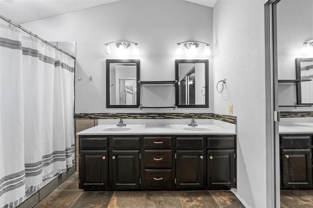 1010 December Drive Hewitt, TX 76643 - Photo 19 of 25 a bathroom with double sink and a mirror