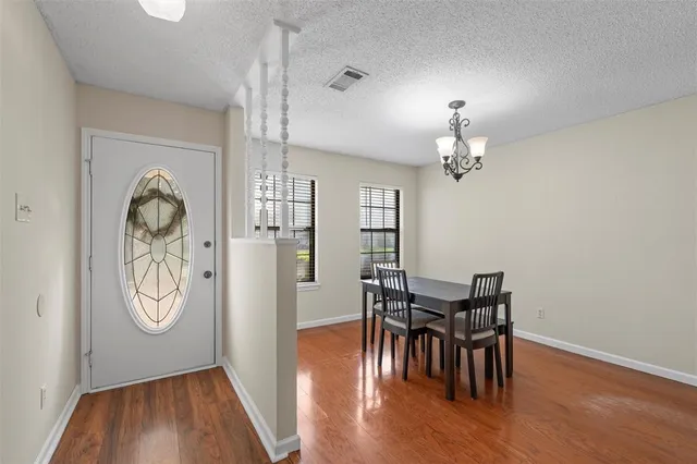 a view of a livingroom with furniture and wooden floor