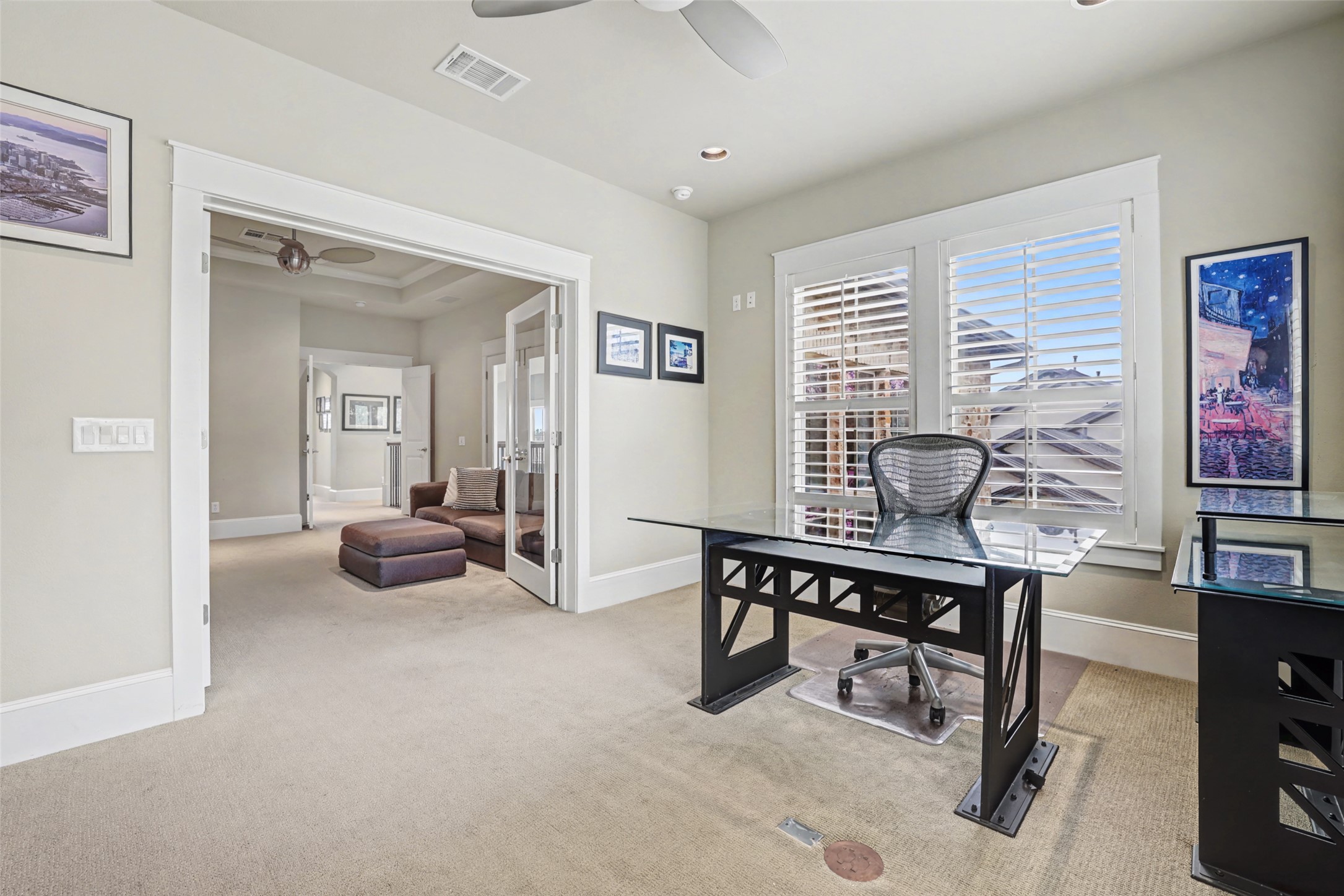 816 Stonewall Ridge Lane Austin, TX 78746 - Photo 22 of 32 A home office with built-ins overlooking backyard on the 2nd floor.