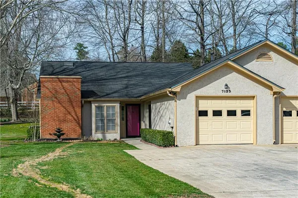 front view of a house with a yard
