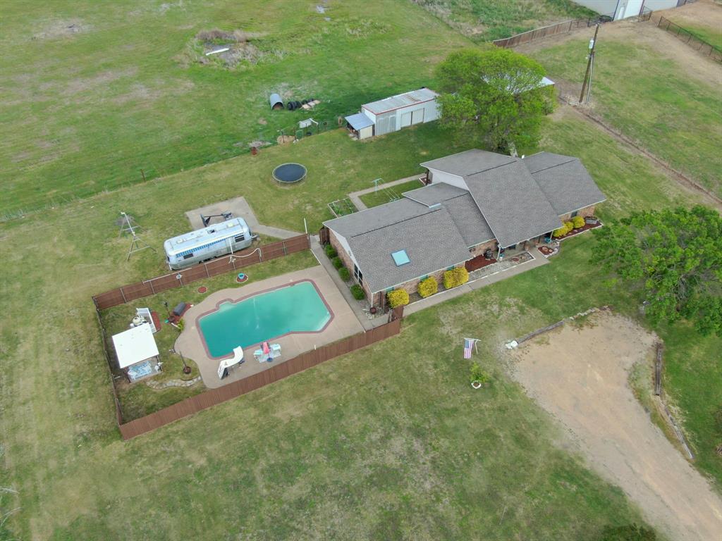 430 Carter Road Italy, TX 76651 - Photo 2 of 36 an aerial view of a house with a yard basket ball court and outdoor seating