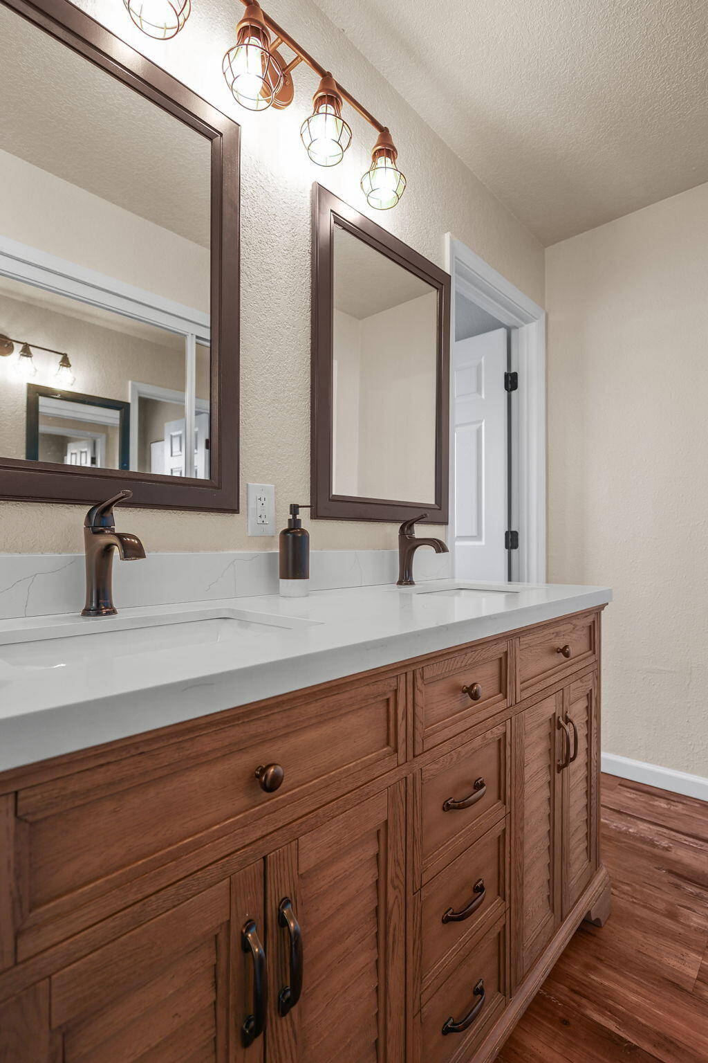 18260 Racoon Drive Lakehead, CA 96051 - Photo 11 of 23 a bathroom with a double vanity sink and mirror