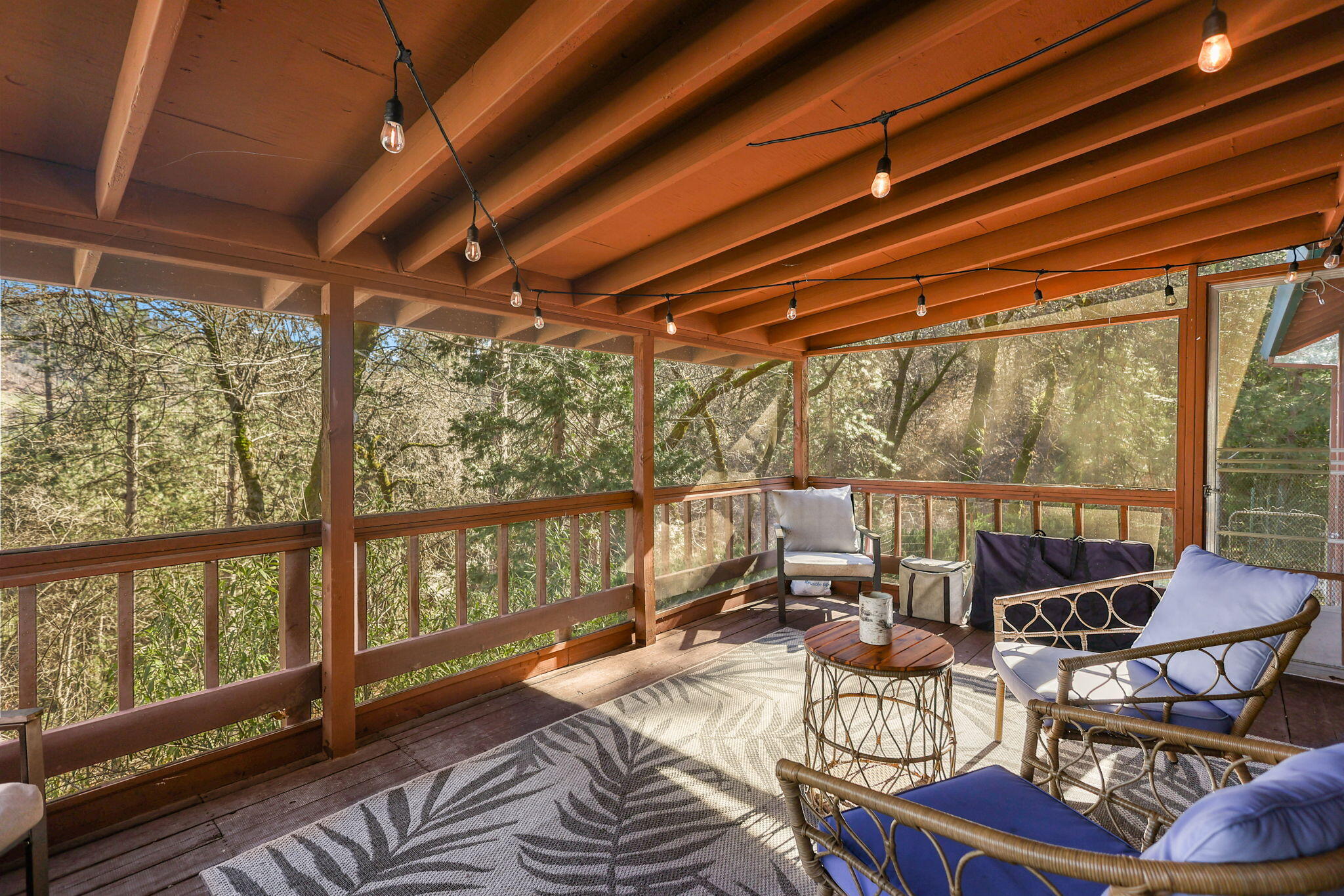 18260 Racoon Drive Lakehead, CA 96051 - Photo 19 of 23 a view of a patio with couches chairs and wooden floor