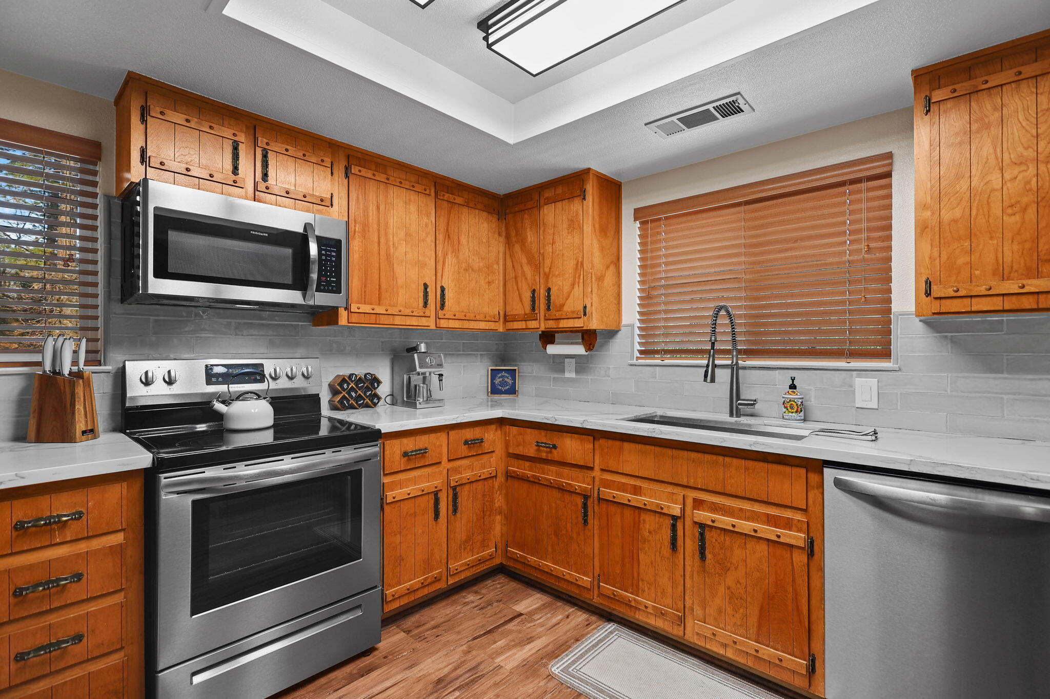 18260 Racoon Drive Lakehead, CA 96051 - Photo 7 of 23 a kitchen with stainless steel appliances granite countertop a stove sink microwave and cabinets