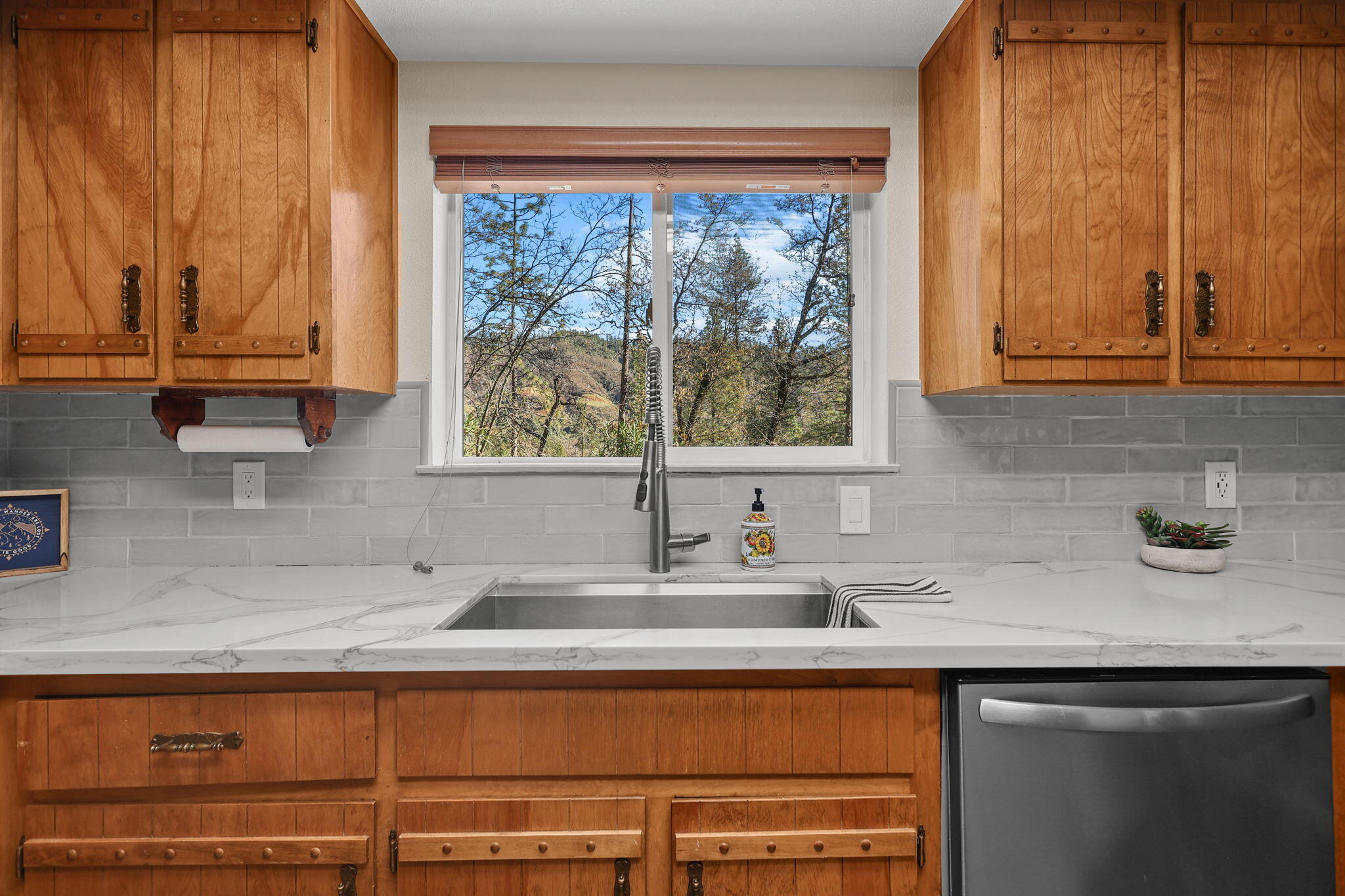 18260 Racoon Drive Lakehead, CA 96051 - Photo 8 of 23 a kitchen with stainless steel appliances a sink a window and cabinets