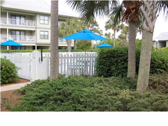 3799 East A Santa Rosa Beach, Unit 10G C30 Santa Rosa Beach, FL 32459 - Photo 13 of 13 a black and white house with a yard and potted plants
