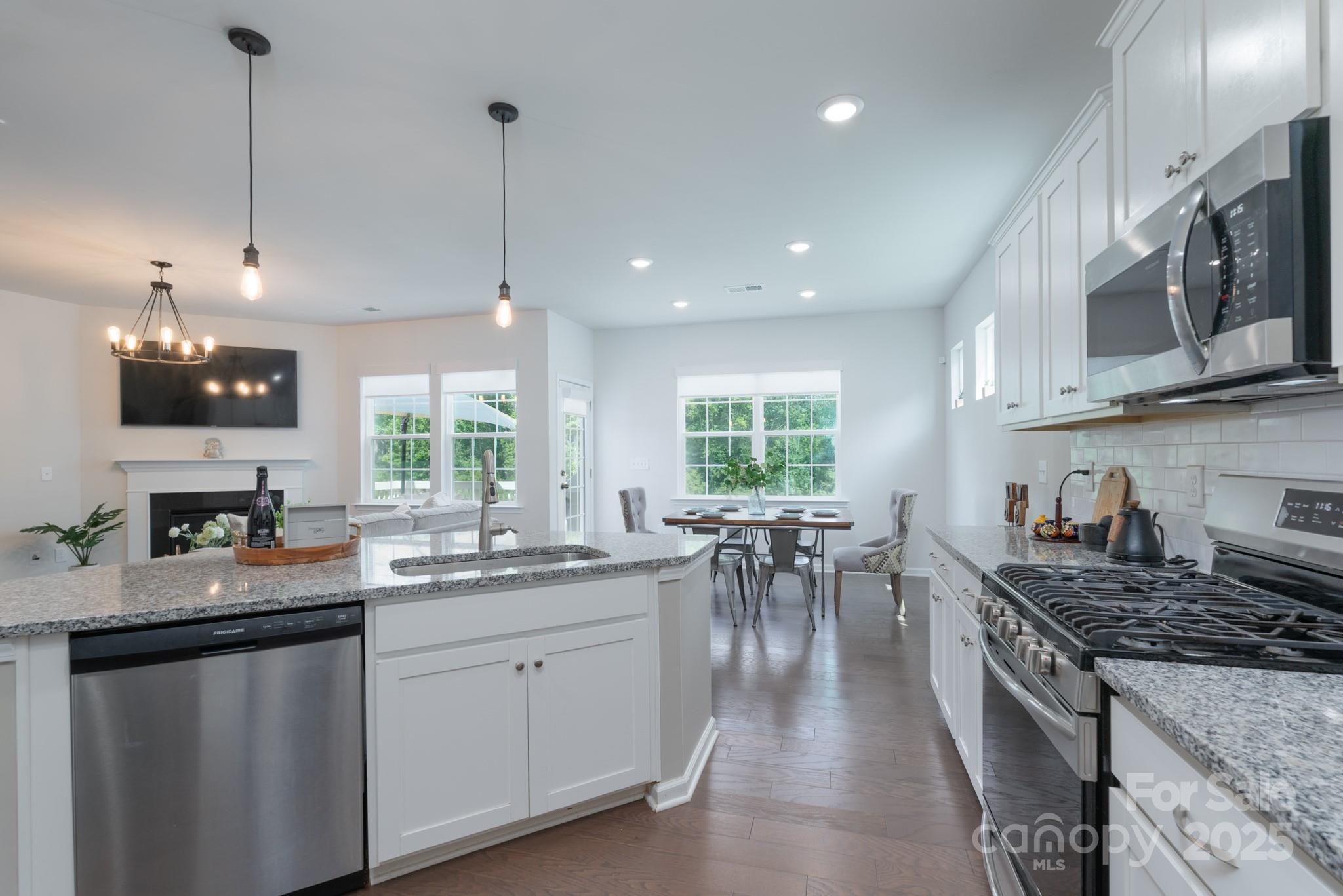 1782 Wildwood Terrace Trail Tega Cay, SC 29708 - Photo 12 of 47 a kitchen with sink stove and cabinets