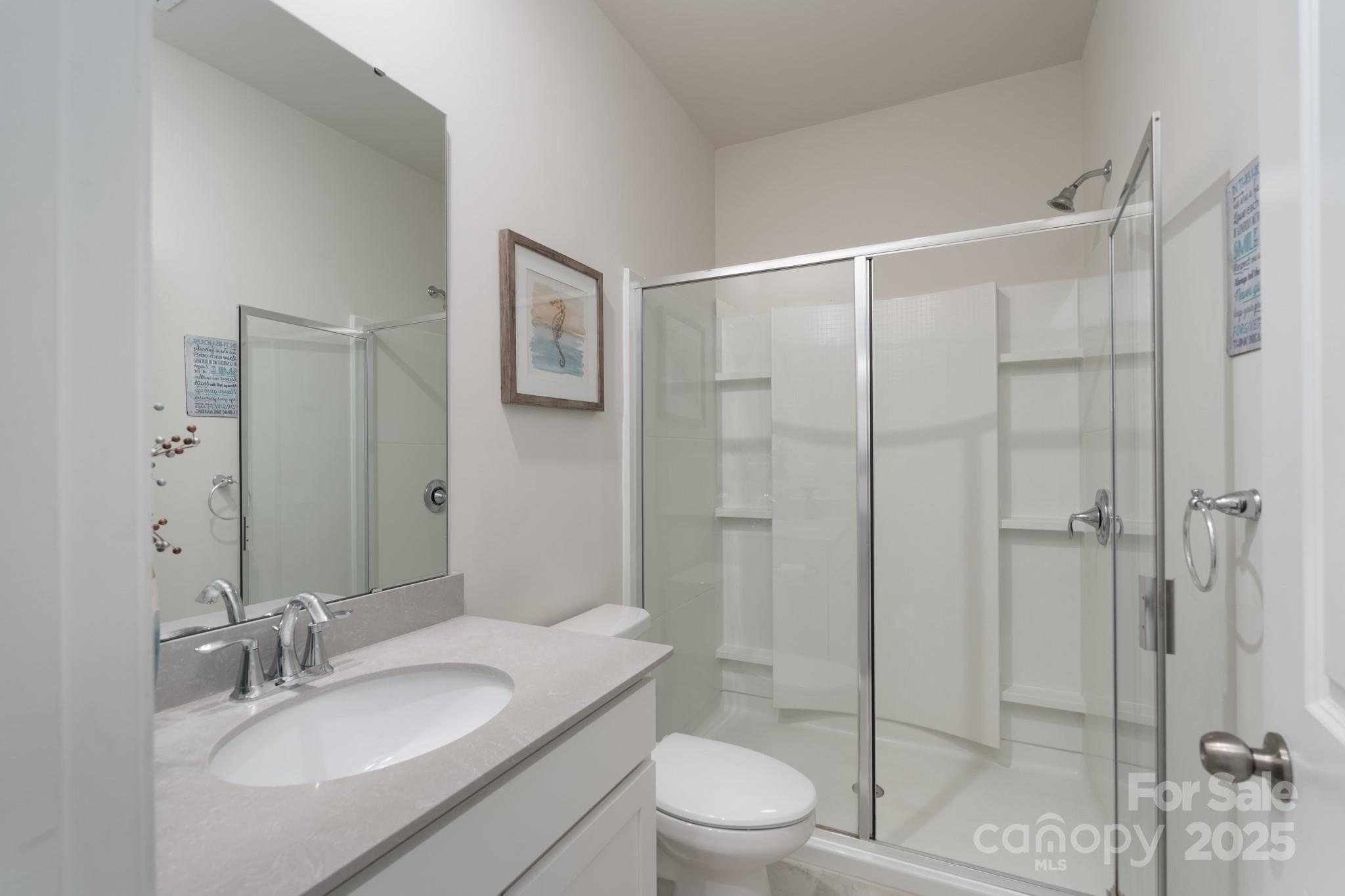 1782 Wildwood Terrace Trail Tega Cay, SC 29708 - Photo 15 of 47 a bathroom with a granite countertop sink toilet and shower