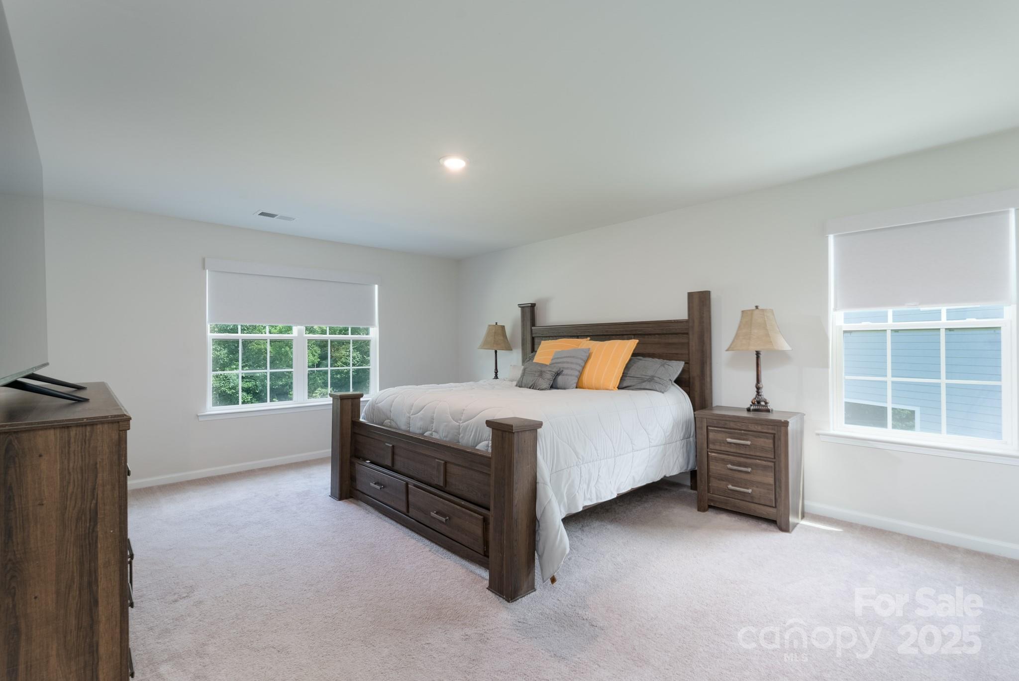 1782 Wildwood Terrace Trail Tega Cay, SC 29708 - Photo 24 of 47 a bedroom with a bed and a window