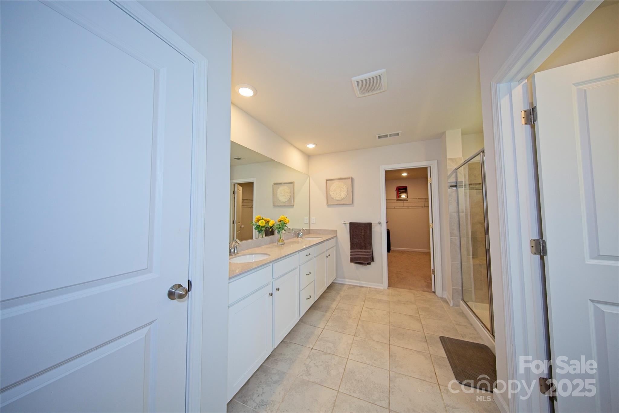 1782 Wildwood Terrace Trail Tega Cay, SC 29708 - Photo 26 of 47 a bathroom with a granite countertop sink a mirror and a bathtub