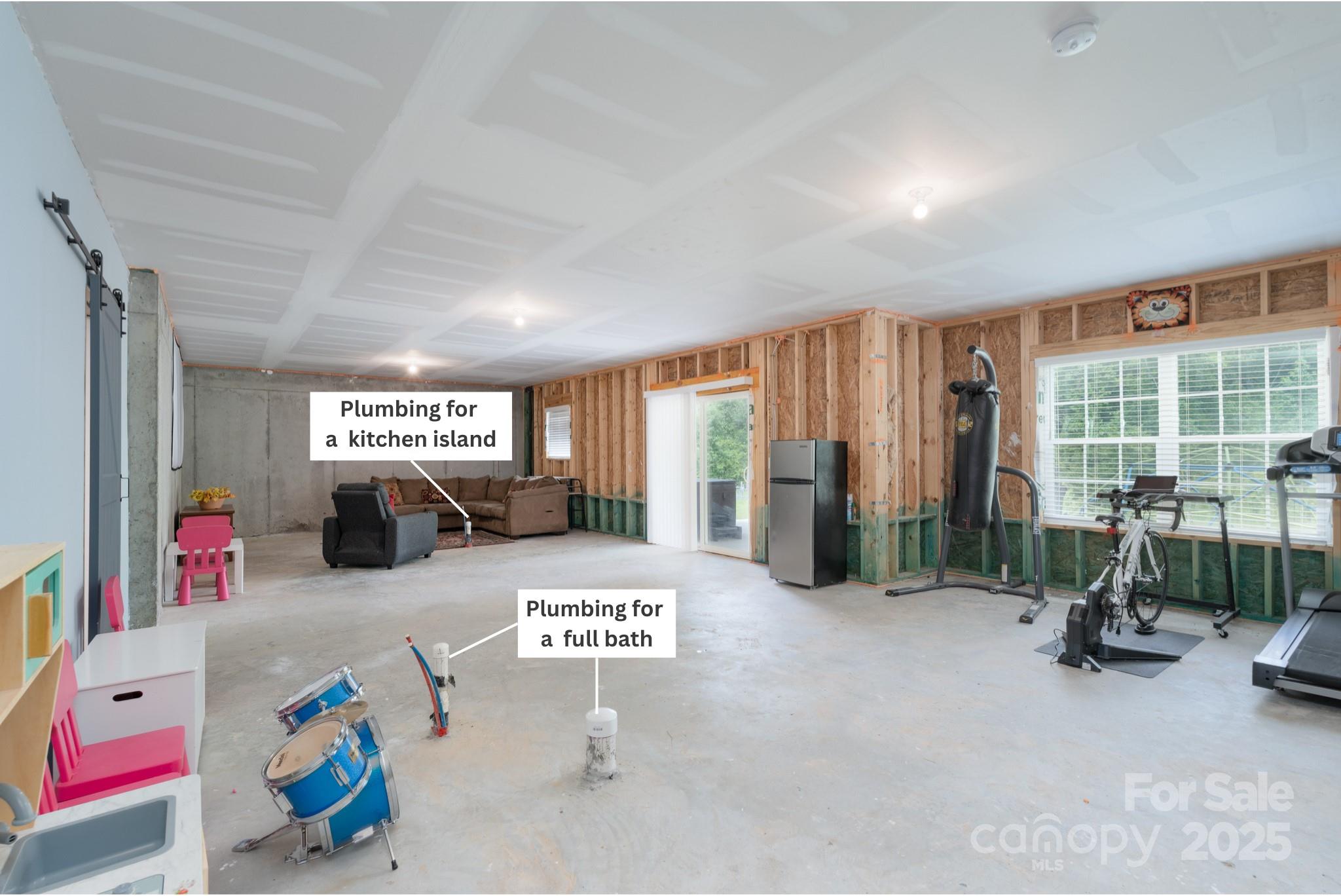 1782 Wildwood Terrace Trail Tega Cay, SC 29708 - Photo 30 of 47 a view of a room with gym equipment and a large window