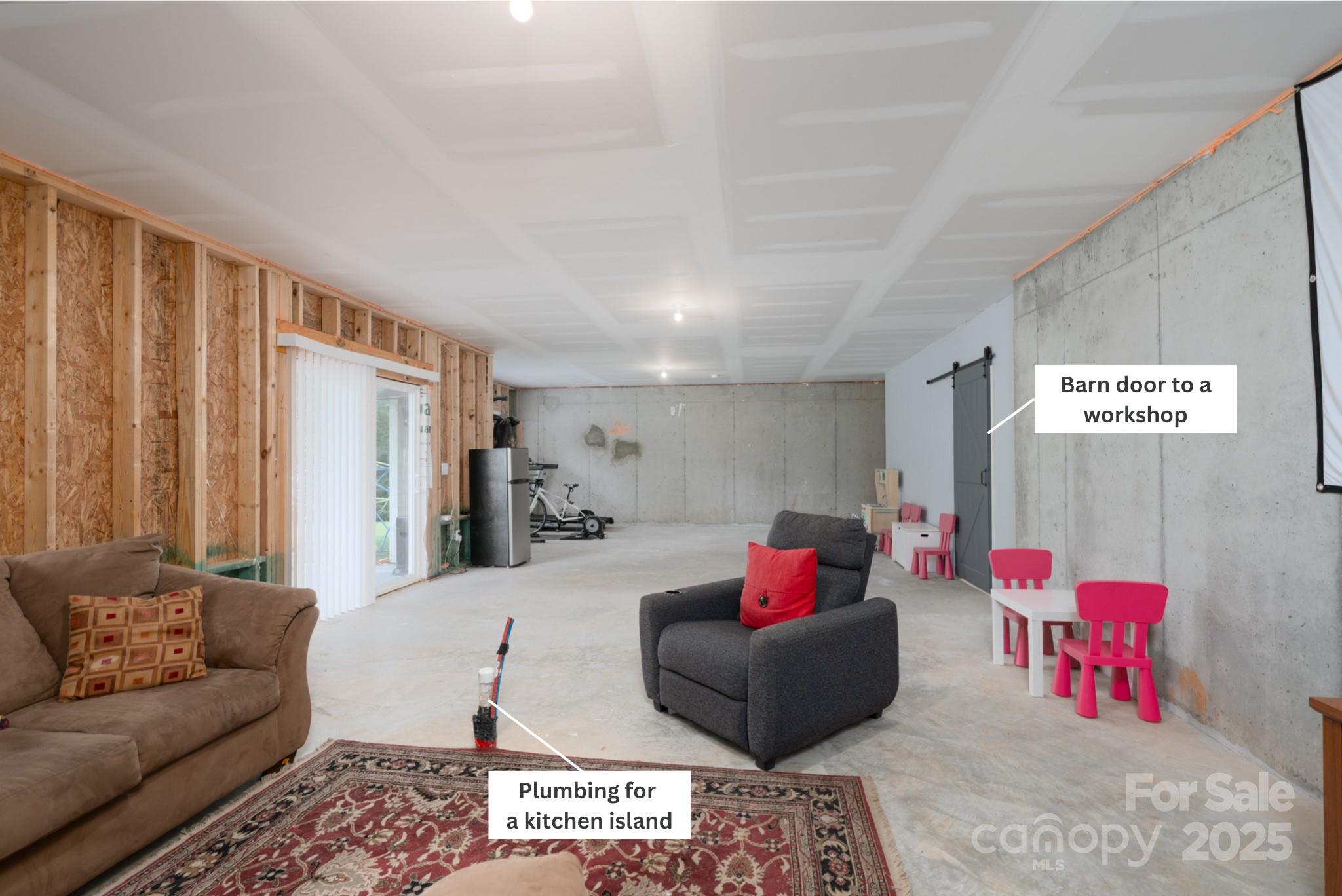 1782 Wildwood Terrace Trail Tega Cay, SC 29708 - Photo 32 of 47 a living room with furniture and a couch