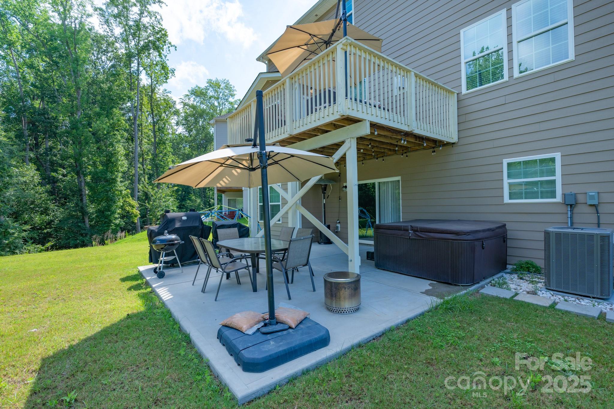 1782 Wildwood Terrace Trail Tega Cay, SC 29708 - Photo 39 of 47 a view of a house with backyard porch and sitting area