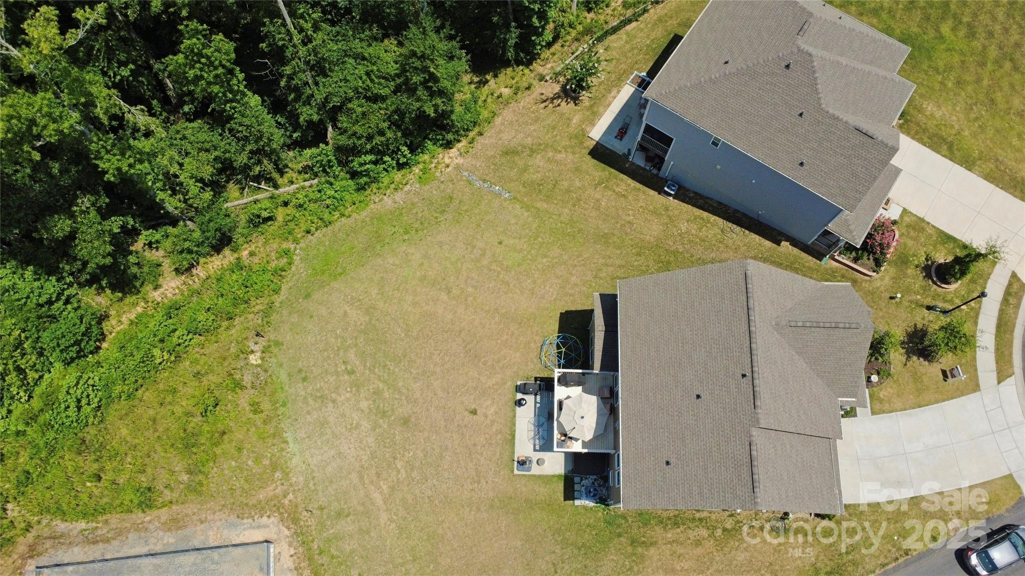 1782 Wildwood Terrace Trail Tega Cay, SC 29708 - Photo 40 of 47 an aerial view of residential house with outdoor space and trees
