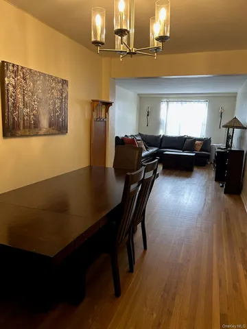 a view of a room with furniture and wooden floor
