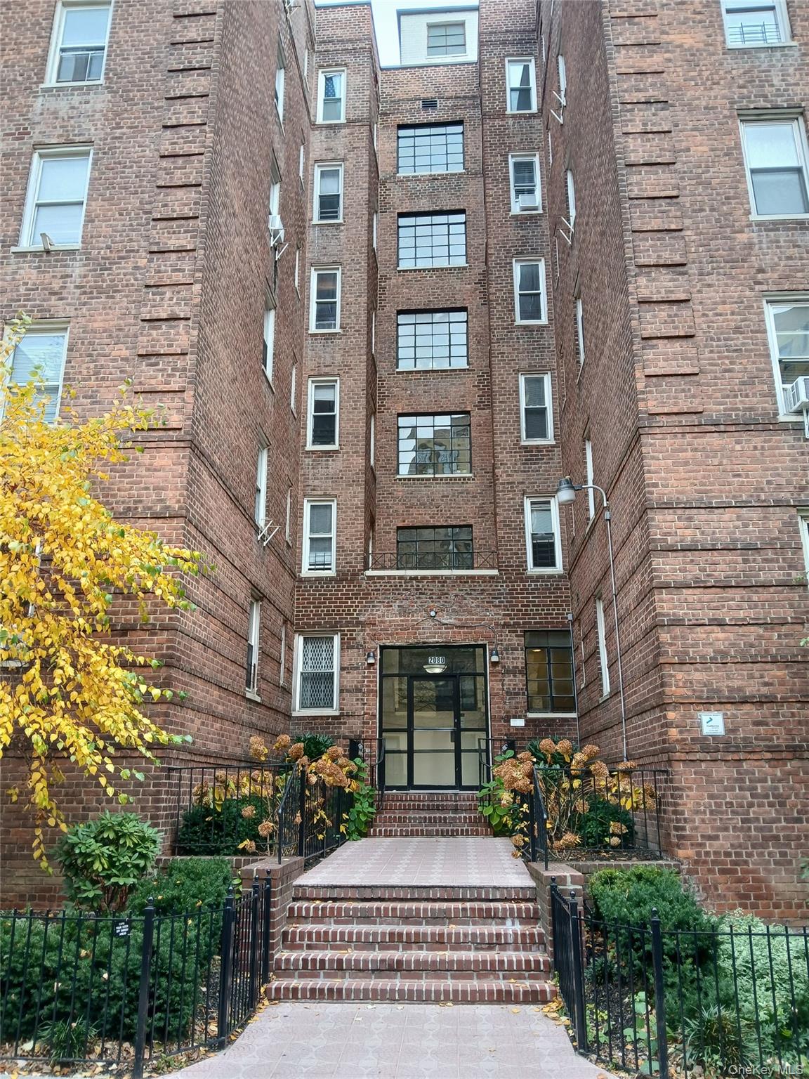 2080 Barnes Avenue, Unit 3B Bronx, NY 10462 - Photo 12 of 16 a front view of a building with garden