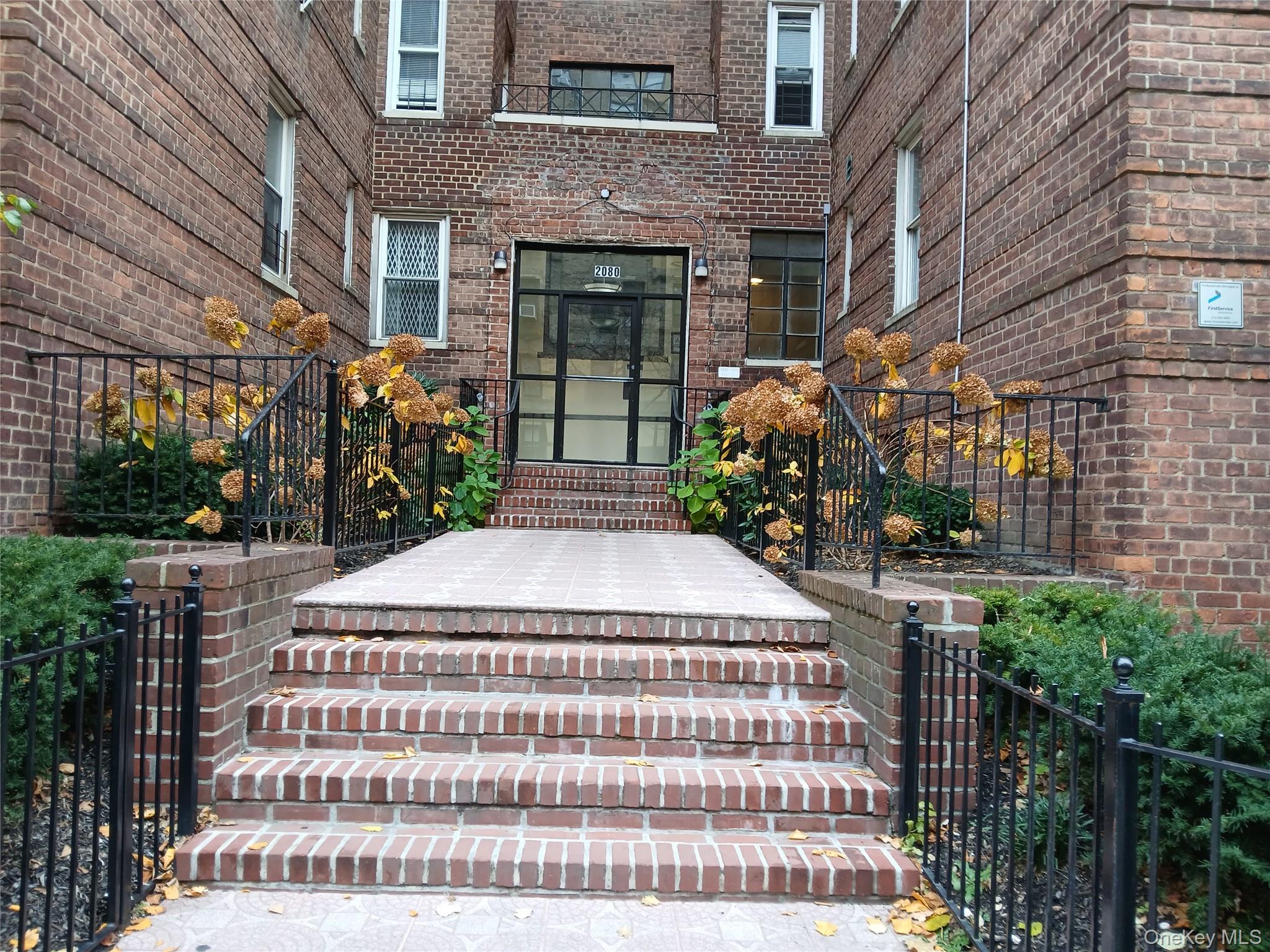 2080 Barnes Avenue, Unit 3B Bronx, NY 10462 - Photo 13 of 16 a front view of a house with garden