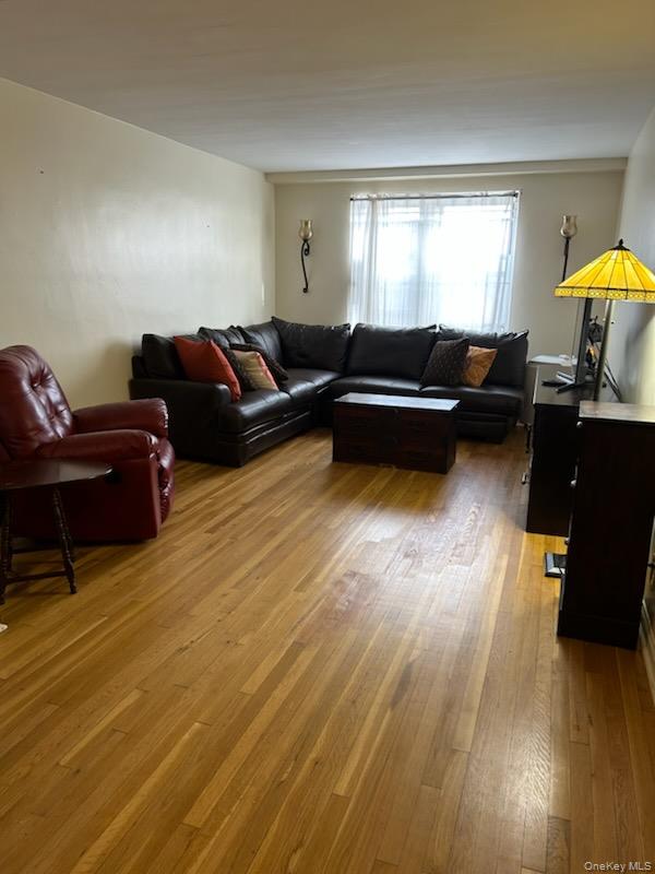 2080 Barnes Avenue, Unit 3B Bronx, NY 10462 - Photo 2 of 16 a living room with furniture and a wooden floor