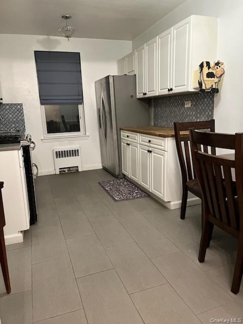 2080 Barnes Avenue, Unit 3B Bronx, NY 10462 - Photo 6 of 16 a kitchen with stainless steel appliances a stove a refrigerator and a sink