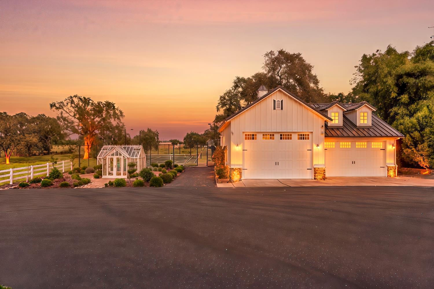 2905 Virginiatown Road Lincoln, CA 95648 - Photo 81 of 86 Two-car garage with white paneled doors, dormer windows, and a metal roof
