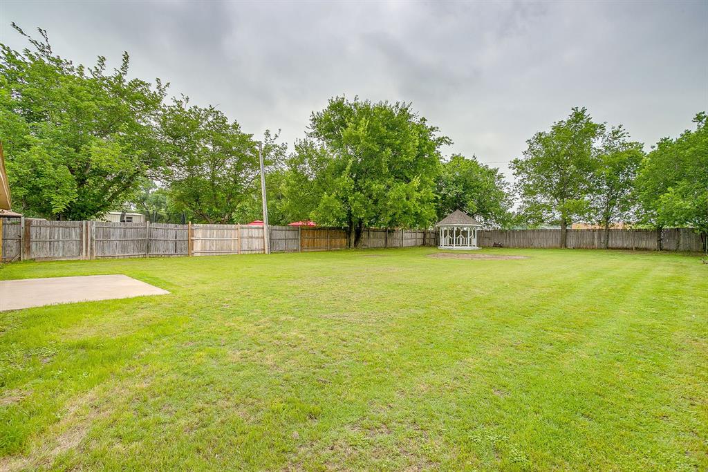 8613 Silver Creek Road White Settlement, TX 76108 - Photo 30 of 40 a view of a swimming pool with a big yard and large trees