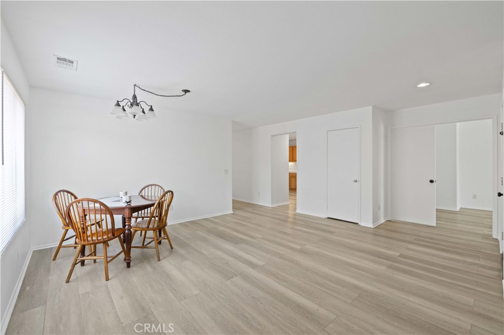 38133 Ranger Drive Palmdale, CA 93552 - Photo 5 of 29 a view of a room with furniture and wooden floor