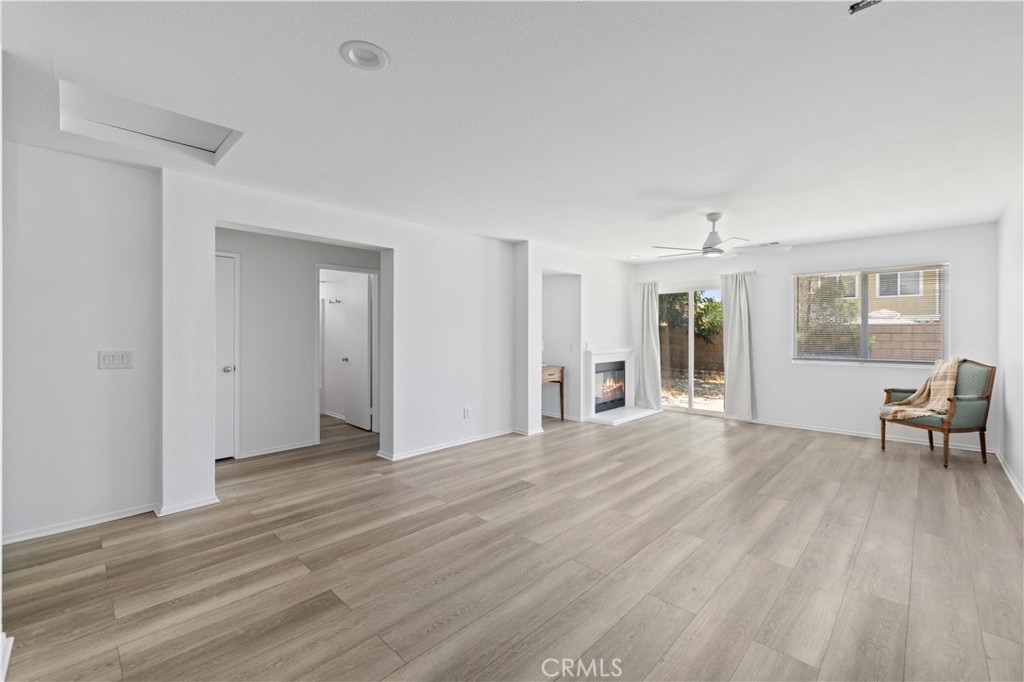 38133 Ranger Drive Palmdale, CA 93552 - Photo 7 of 29 a view of empty room with wooden floor and fan
