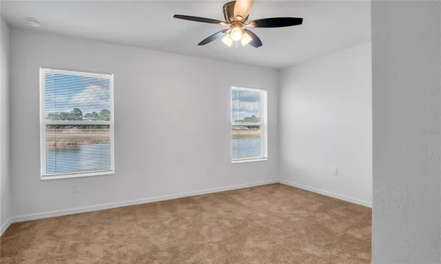 a view of empty room with windows