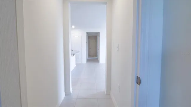 a view of a bathroom from a hallway